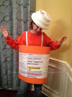 a woman wearing an orange bucket costume with a white hat on her head and hands in the air