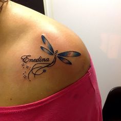 a woman with a tattoo on her shoulder that says,'endina'and a dragonfly