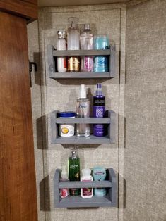 two shelving shelves in a bathroom filled with personal care items and toiletries on the wall