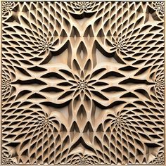 an intricate wood carving pattern in the shape of a flower, with petals and leaves on it