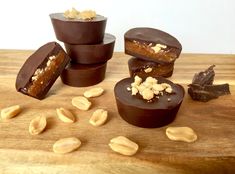 five pieces of chocolate with nuts on top