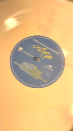 a yellow record with writing on it