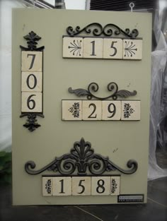 an old fashioned house number sign with numbers on it