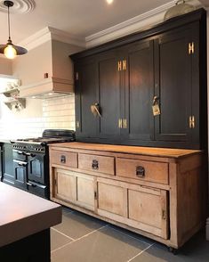 a kitchen with an oven, stove and cabinets