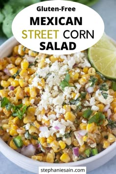 mexican street corn salad in a white bowl with lime and cilantro on the side