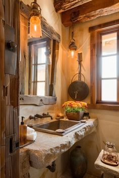 a bathroom with a sink, mirror and lights on the wall next to a window