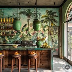 the kitchen is decorated with tropical wallpaper and wooden stools, along with two green vases