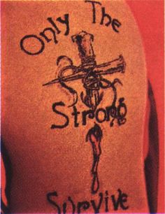 the back of a woman's shirt that says, only the strong survive