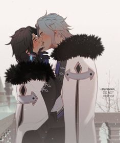 two people kissing each other in front of snow