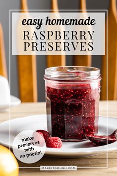 raspberry preserves in a glass jar on a white plate with the words easy homemade raspberry preserves