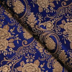 blue and gold brocaded fabric with floral designs