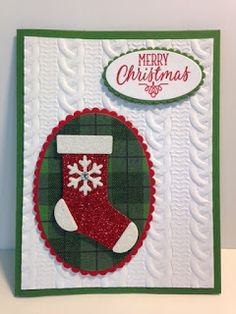 a christmas card with a stocking and snowflakes