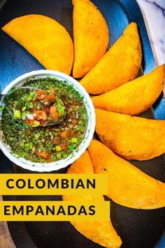 mexican food is served on a plate with the words, colombia empanadas