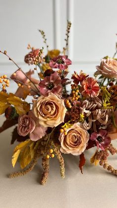 a bouquet of flowers sitting on top of a table