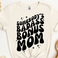 This bonus mom shirt makes a totally unique step mom gift for step mothers of all kinds! Grab this tee today while it's on sale! Delivery Times: ◦ Production: 1 business day on average (maximum: 7) ◦ Shipping: 2 business days on average (maximum: 3) Unisex Fit: ◦ Extra soft, preshrunk unisex t-shirt ◦ Women: Semi-fitted, laidback, rollable, & tuckable ◦ Men: Fitted on upper body & loose around the belly ☞ Size up for a looser fit Soft Materials: ◦ Super soft, preshrunk tee with eco-friendly mate Step Mom Mothers Day Gifts, Bonus Mom Shirt, Step Mother Gifts, Bonus Mom Gifts, Bonus Mom, Step Mom Gifts, Step Mom, Shirts Ideas, Pottery Crafts