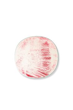 a red and white plate on a white background