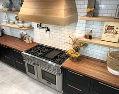 a stove top oven sitting inside of a kitchen next to wooden shelves and counter tops