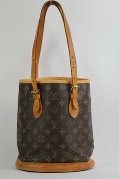 Authentic LOUIS VUITTON  M42238 Petit Bucket PM  Monogram Canvas with CERTIFICATE OF AUTHENTICATION 100% Authentic or Money Back Guaranteed if proven fake Very elegant Great as a day bag, goes with almost all outfit. Great staple to keep in your closet! Just take a look at the picture! You will receive the exact items pictured above so please look at the pictures closely so you know what you're buying  OUTSIDE: Rank BC INSIDE: Rank SA CONDITION - DESCRIPTION OF RANK: N Brand-new, unused, unworn Sac Noe Louis Vuitton Vintage, Louis Vuitton Bucket Bag, Pm Monogram, Day Bag, Louis Vuitton Speedy Bag, Monogram Canvas, Authentic Louis Vuitton, Mint Condition, Louis Vuitton Monogram