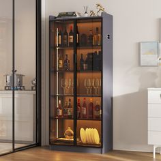 a tall cabinet filled with lots of bottles and glasses