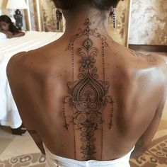 a woman with a tattoo on her back