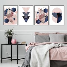 three paintings on the wall above a bed in a room with pink and blue decor