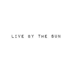 the words live by the sun are black and white