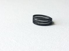 Minimal Iron Ring, Simple Black Ring, Plain Handmade Ring, Dark Grey Ring, Metal Rustic Ring, Raw Wire Ring, Unisex Steel Band, Women Band This simple 3 story iron ring was handmade from an iron wire. Minimal, a little masculine. For someone who likes a little bit of edge. For someone bored with shiny polished girly style rings.  Let me know what size you need! I'll create one just for you. Ring will be packed in a linen satchet and shipped to you in a bubble envelope as soon as possible.  Mater Minimalist Adjustable Black Rings, Black Adjustable Stackable Rings, Adjustable Black Stackable Rings, Adjustable Black Rings For Everyday Wear, Minimalist Handmade Black Ring, Adjustable Black Stackable Open Rings, Adjustable Black Midi Rings For Gift, Grey Ring, Gray Ring