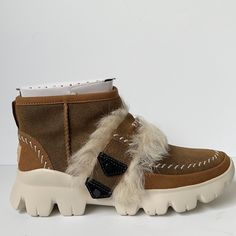 Combination Of Twin Face Sheepskin And Soft Leather Upper Toscana Sheepskin Along Shaft And Zipper Contrasting Whipstitch Detail Along Upper And Heel Counter Lateral Zipper With Leather Tassel Pull 17mm Sheepskin Lining 17mm Sheepskin Insole Woven Sock Label With Ugg Logo Treadlite By Ugg Midsole For Added Comfort And Support Leather Outsole Welt Vibram Outsole With Non-Slip Traction Rubber Nylon Binding Metal Ugg Logo Heel Plate Brown Sheepskin Boots For Fall, Brown High-top Shearling Boots, Brown Sheepskin Boots With Faux Fur Lining, Winter Beige Calf Leather Boots, Leather Boots With Faux Fur Lining For Fall, Beige Shearling Boots For Fall, Shearling Boots With Round Toe For Fall, Casual Brown Sheepskin Boots, Fall Shearling Boots With Round Toe