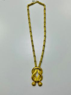 ALL ITEMS ARE SUBJECT TO AVAILABILITY  TESTED AND GUARANTEED A beautiful hand made Ilias Lalaounis necklace Herculean love knot pendant. Herculean knot represents strength and a symbol of undying love. Also called the love knot In Greece Herculean knot is still used in medicine for the belief that wounds heal faster This necklace is 22kt gold. The tubular gold links are on a braided 18kt chain. The necklace part without the pendant measures 24 inches. The pendant measures 2 1/2 inches 97.6 grams Lalaounis (1920-2013) is the only jeweler who is recognized by Academy des Beau Arts making his objects a work of art A spectacular special piece Gold Pendant Necklaces For Evening, Art Deco Gold Necklace With Large Pendant, Gold Art Deco Necklace For Formal Occasions, Art Deco Gold Necklace For Formal Occasion, Art Deco Yellow Gold Pendant Necklace, Art Deco Gold Necklace For Anniversary, Gold Art Deco Round Necklace, Undying Love, Love Knot Necklace