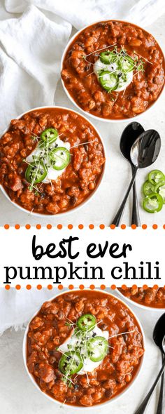 three bowls of best ever pumpkin chili with spoons on the side and in front