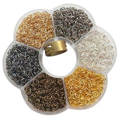 various types of rings and chains are arranged in a circle on a white background with gold, silver, and black colors