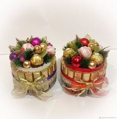 two cakes decorated with christmas ornaments and bows