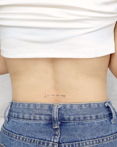 the back of a woman's stomach with an inscription on her left side that reads, i love you so much