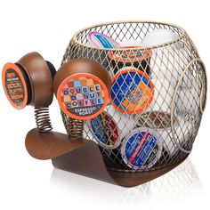 a basket filled with assorted coffee items on top of a white table next to a bottle opener