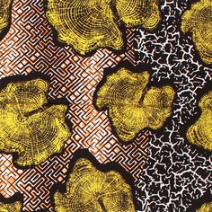 yellow flowers on black and white patterned fabric