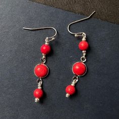 These red coral earrings created by Jewelry By Carmal are made of:  red coral gemstones, sterling silver:  earring hooks and findings. These earrings are 2 inches in length. All of our jewelry comes wrapped and ready for gift giving!  We also offer free standard shipping within the United States. We accept custom orders and would love to work with you! Please see other items in our shop: http://www.jewelrybycarmal.etsy.com s Red Dangle Earrings With Ear Wire, Red Hypoallergenic Dangle Earrings, Hypoallergenic Red Dangle Earrings, Handmade Red Coral Dangle Earrings, Red Hypoallergenic Round Bead Earrings, Red Coral Earrings, Coral Earrings, Sterling Silver Jewellery, Earring Hooks