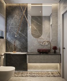 a modern bathroom with marble walls and flooring, along with a white toilet and sink