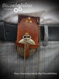 "Want to wear a pocket watch but don't have any pockets? Then this pocket watch holder is for you, simply slide it on to a belt (up to 2\" wide).  A great compliment to any outfit Made from real leather and measuring 2\" x 4\" the holder has been dyed a lovely rich brown. The holder, the watch and the chain are all included!" Steampunk Style Watch With Leather Strap As A Gift, Steampunk Pocket Watch With Compass Design, Steampunk Watches With Leather Strap As Gift, Steampunk Metal Pocket Watch For Formal Occasions, Steampunk Quartz Pocket Watch For Formal Occasions, Vintage Handmade Watches For Everyday Use, Handmade Vintage Watches For Everyday Use, Handmade Vintage Watches For Everyday, Handmade Vintage Watches