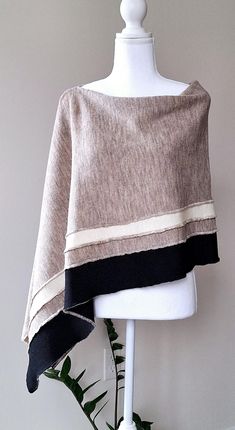 This nice beige colour with white and black stipes merino wool poncho is very elegant and is suited to complement different outfits, it is also suitable for weddings or other formal events in your life. It's the simplest way to add some colour and freshness to your wardrobe and stylize your everyday garments. A great gift for a loved one.    Knitted 100% merino wool ponchos. The poncho is available in one size. ❤️ Several wearing variants: as poncho, scarf, headgear, scarf, cape, vest and etc. ❤ Autumn Shawl, Scarf Cape, Poncho Scarf, Boho Caftan, Merino Wool Scarf, Beige Colour, Wool Poncho, Wool Wrap, Different Outfits