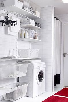 a washer and dryer in a white laundry room