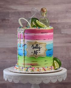 a multicolored cake decorated with limes and confetti