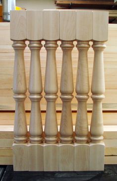 a set of wooden balconies sitting on top of a piece of plywood