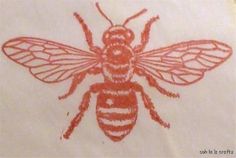 a drawing of a bee is shown on a piece of white paper with red ink