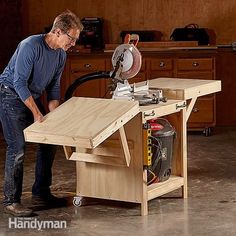 a man working on a table sawing