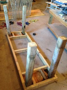 two wooden posts are in the process of being assembled and put together to make a boat