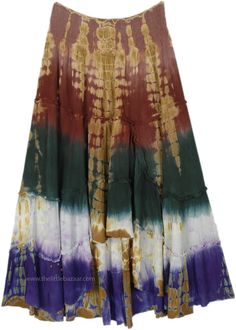 This maxi skirt boasts a stunning display of earth-toned colors and a captivating tie-dye pattern that oozes bohemian charm. The skirt starts with a warm burgundy waist that seamlessly transitions into soft amber and gold tones, blooming into a deep forest green, with purple at the hem. #tlb #TieredSkirt #vacationclothing #beachwrap #TieDye #TieDyelongSkirt #summerskirt Bohemian Tie-dye Spring Maxi Skirt, Bohemian Tie Dye Tiered Skirt, Bohemian Multicolor Boho Print Maxi Skirt, Bohemian Tiered Tie Dye Skirt, Summer Bohemian Batik Print Skirt, Bohemian Batik Print Skirt For Summer, Bohemian Batik Print Summer Skirt, Green Flowy Bohemian Maxi Skirt, Hippie Tie-dye Skirt For Festival