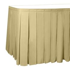 a beige pleated table skirt on a white background