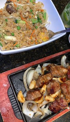 two plates of food sitting on top of a table next to another plate filled with meat and veggies