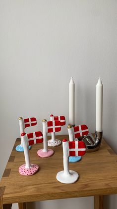 some candles are sitting on a wooden table