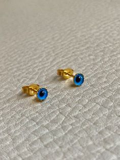 Vintage 18k Gold Evil Eye Stud Earrings  Do you need to ward off bad luck? You might enjoy this pair of evil eye stud earrings. 18k yellow gold set evil eye cabochons. Perfect to wear front and center or higher up the earlobe as well! Details  * Hallmarked for 18k gold  * Excellent vintage condition   Jewelry ships free and fully insured. Please reach out with any questions jill@p-penelope.com Bad Luck, Yellow Gold Setting, Gold Set, Do You Need, Evil Eye, Etsy Earrings, San Francisco, 18k Gold, Yellow Gold